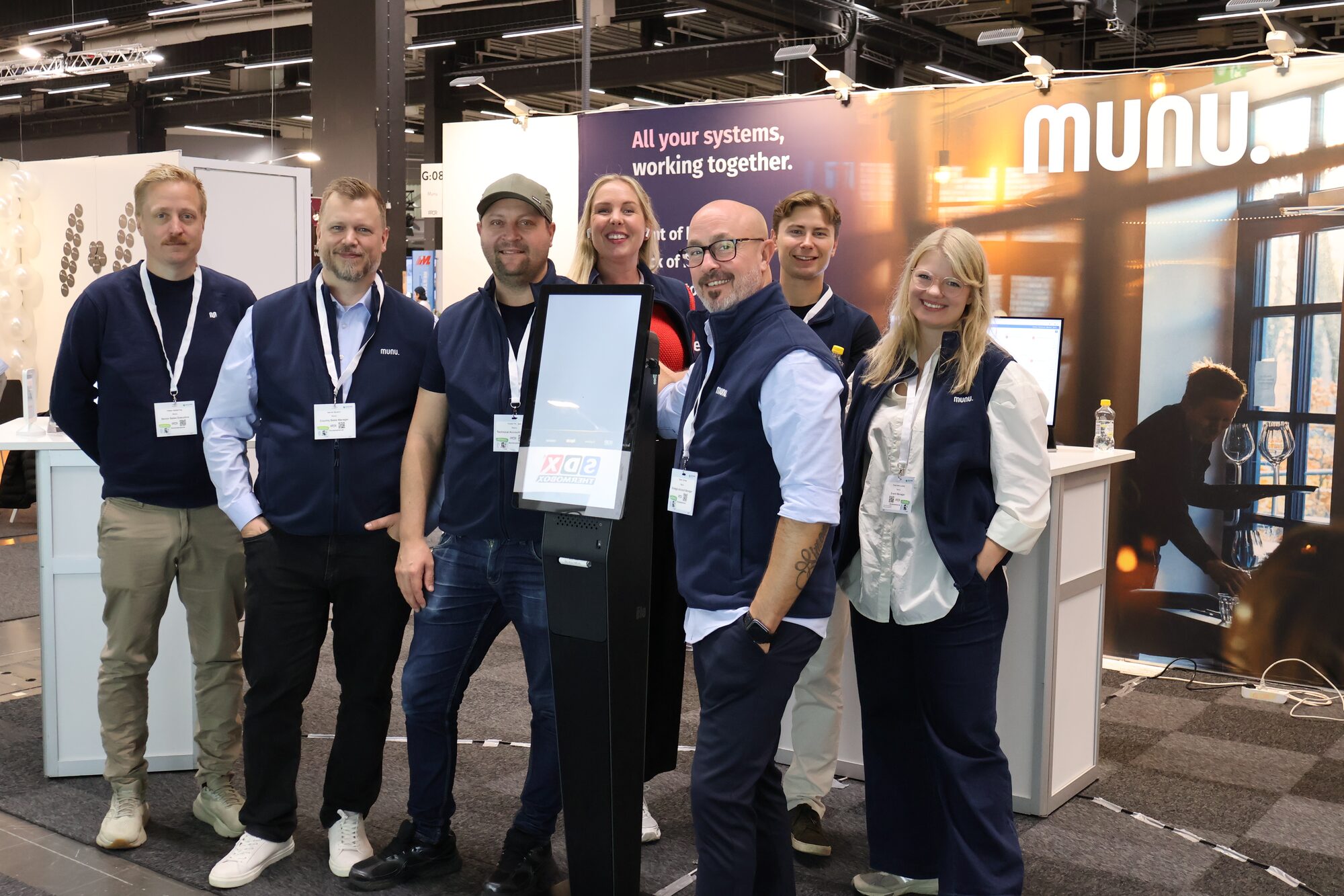 Munu colleagues at a trade show
