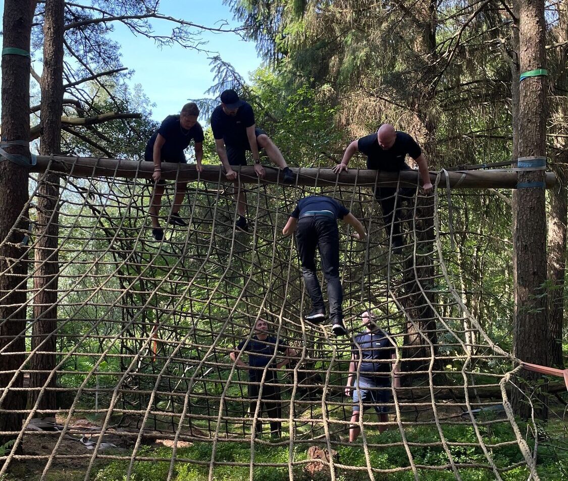 Colleagues climbing